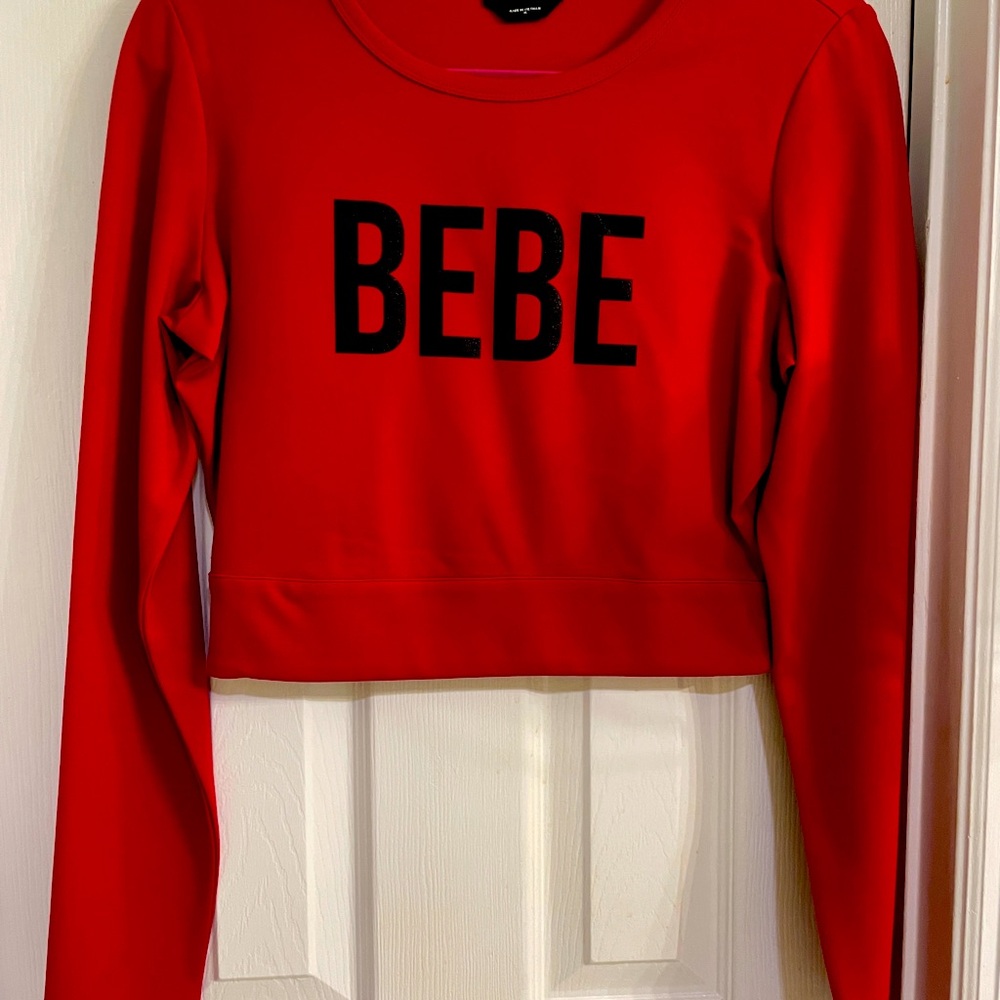 Women’s BeBe Red long sleeve crop top.